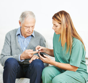 man checking his blood sugar level